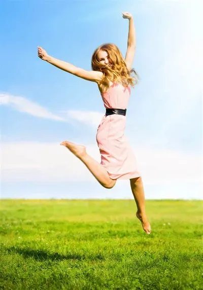 A woman jumping with confidence after receiving a Votiva treatment